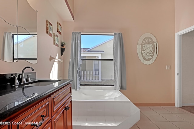 2805 Forest Run Dr, Melbourne, FL 32935 - bathroom featuring vanity, a garden tub, and tile patterned flooring