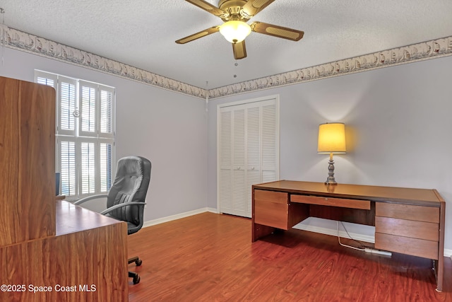 2805 Forest Run Dr, Melbourne, FL 32935 - office featuring wood finished floors, baseboards, a textured ceiling, and ceiling fan