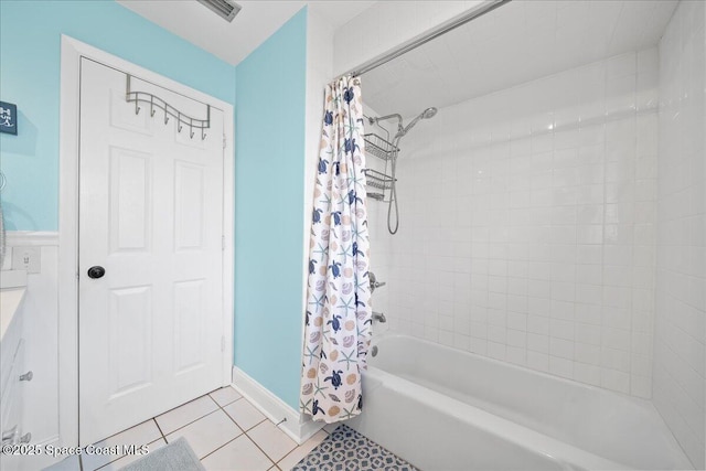 bathroom featuring tile patterned flooring and shower / tub combo with curtain