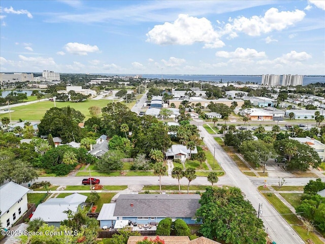 view of urban area with a large body of water