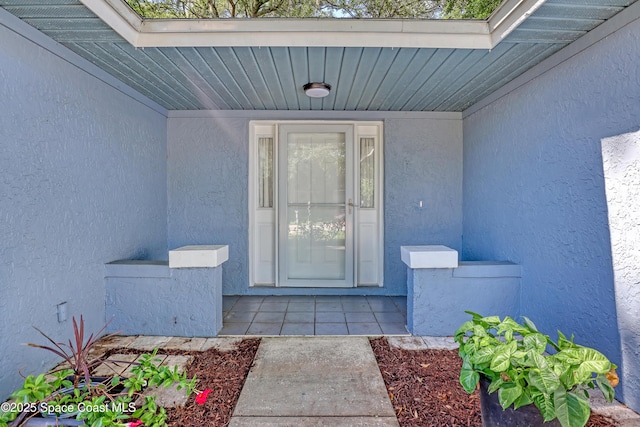 690 Koutnik Rd SE, Palm Bay, FL 32909 - property entrance with stucco siding