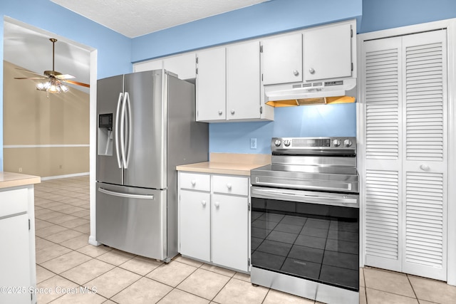 690 Koutnik Rd SE, Palm Bay, FL 32909 - kitchen featuring appliances with stainless steel finishes, under cabinet range hood, light countertops, ceiling fan, and light tile patterned floors