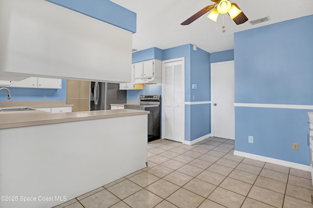690 Koutnik Rd SE, Palm Bay, FL 32909 - kitchen featuring stainless steel appliances, under cabinet range hood, ceiling fan, light countertops, and white cabinetry