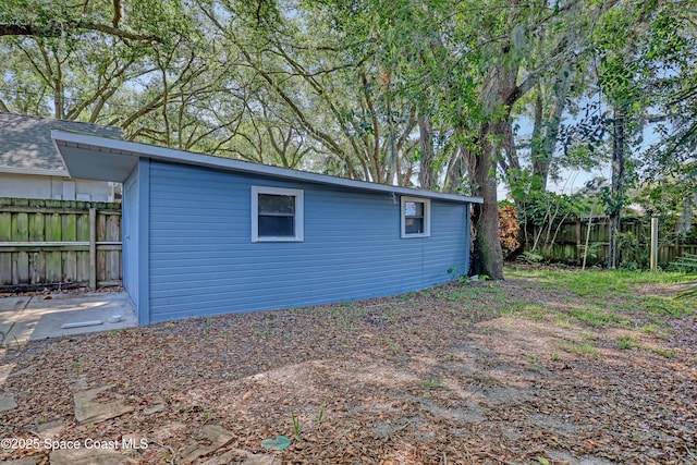 690 Koutnik Rd SE, Palm Bay, FL 32909 - view of side of property featuring a fenced backyard