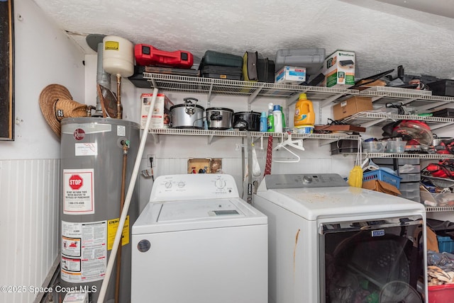 958 Beaumont Ln, Rockledge, FL 32955 - laundry area with washer and dryer, gas water heater, and a textured ceiling