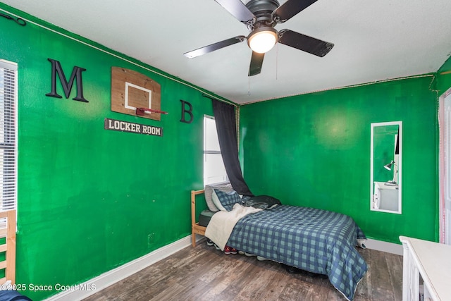 958 Beaumont Ln, Rockledge, FL 32955 - bedroom with wood finished floors, baseboards, and ceiling fan