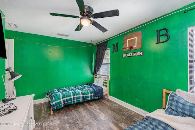 958 Beaumont Ln, Rockledge, FL 32955 - bedroom with wood finished floors, baseboards, and ceiling fan