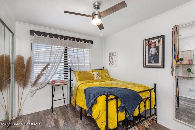 958 Beaumont Ln, Rockledge, FL 32955 - bedroom with wood finished floors, crown molding, baseboards, and ceiling fan