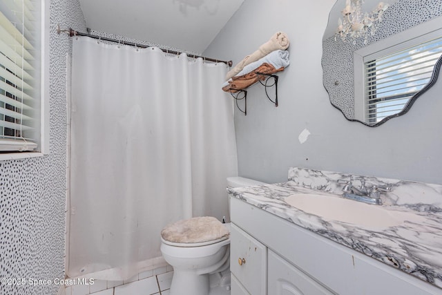 958 Beaumont Ln, Rockledge, FL 32955 - full bathroom featuring toilet, vanity, tile patterned flooring, curtained shower, and a chandelier