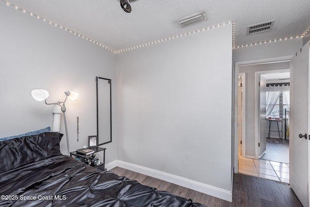 958 Beaumont Ln, Rockledge, FL 32955 - bedroom with wood finished floors and baseboards