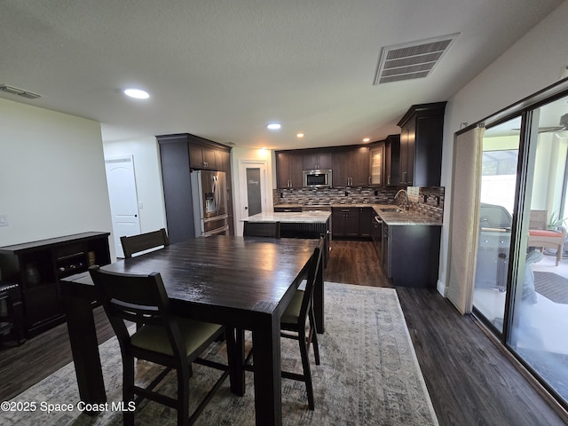 334 Dryden Cir, Cocoa, FL 32926 - dining space featuring dark wood-style flooring and recessed lighting