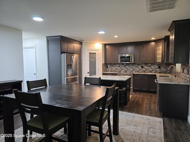 334 Dryden Cir, Cocoa, FL 32926 - dining area with dark wood finished floors and recessed lighting