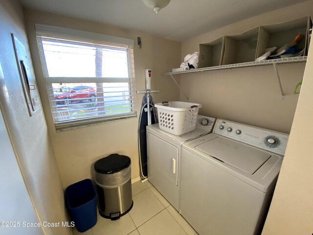 35 Sunflower St Unit 59, Cocoa Beach, FL 32931 - washroom featuring independent washer and dryer and light tile patterned floors