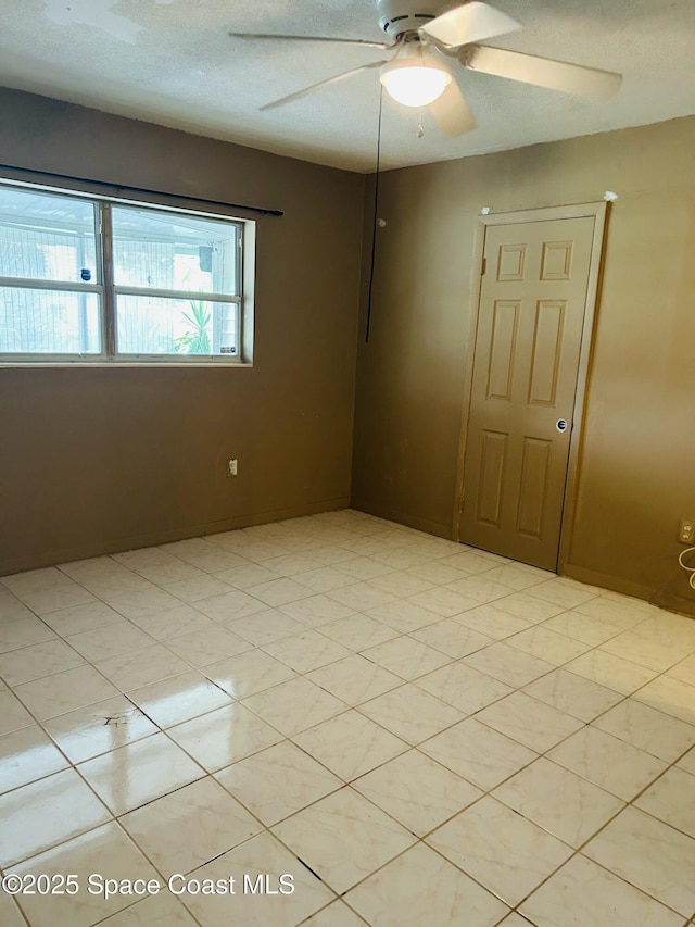 2174 Woodbury Rd, Melbourne, FL 32935 - spare room featuring a ceiling fan