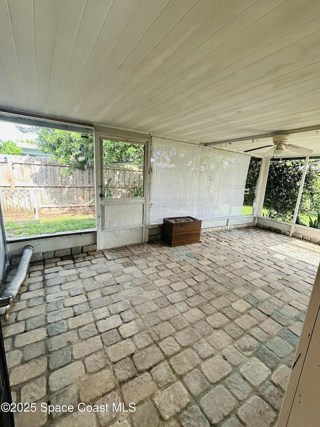 2174 Woodbury Rd, Melbourne, FL 32935 - unfurnished sunroom featuring ceiling fan