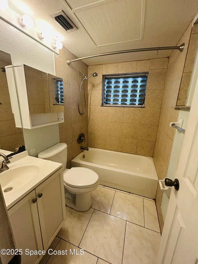 2174 Woodbury Rd, Melbourne, FL 32935 - full bathroom with shower / washtub combination, vanity, tile patterned flooring, and toilet