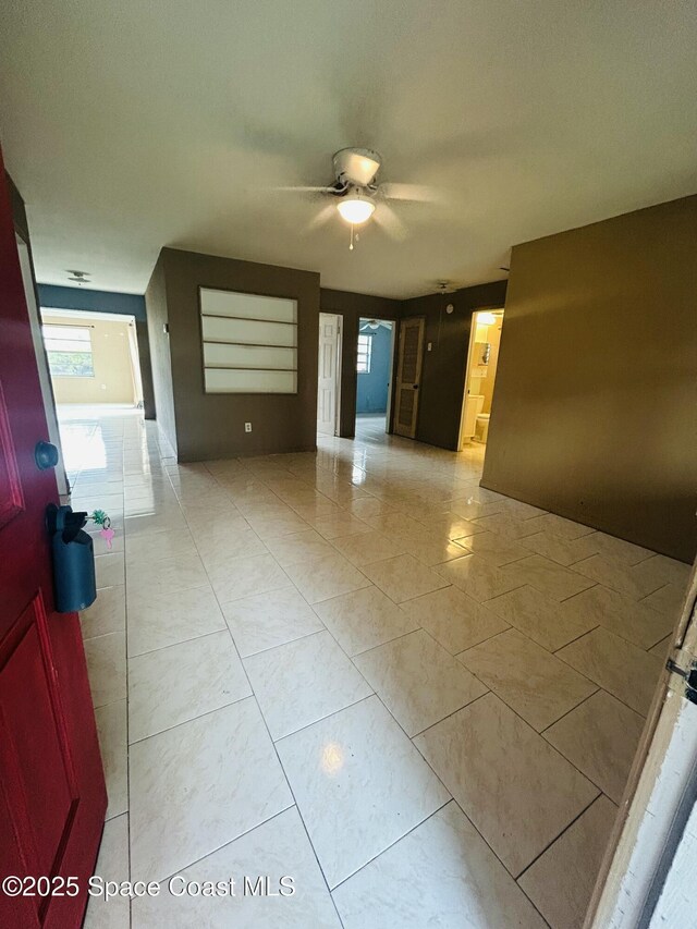 2174 Woodbury Rd, Melbourne, FL 32935 - spare room featuring a ceiling fan