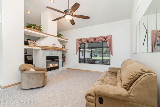 7793 Windover Way, Titusville, FL 32780 - living room featuring a high end fireplace, ceiling fan, carpet flooring, lofted ceiling, and baseboards