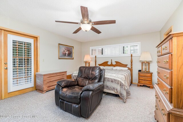 7793 Windover Way, Titusville, FL 32780 - bedroom with light colored carpet, access to outside, a ceiling fan, and a textured ceiling