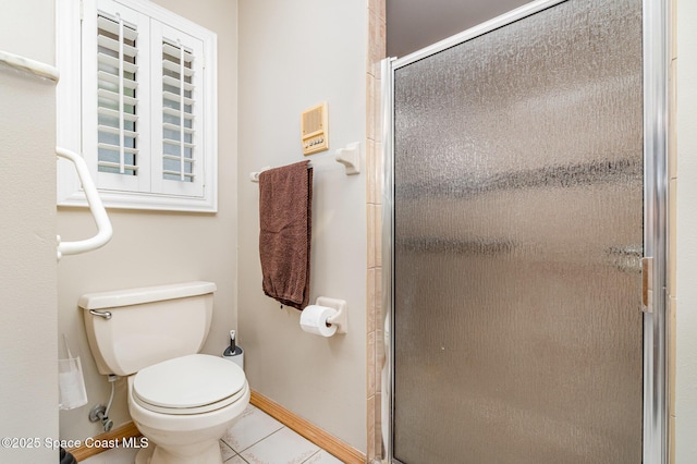7793 Windover Way, Titusville, FL 32780 - full bathroom with tile patterned flooring, a shower stall, toilet, and baseboards