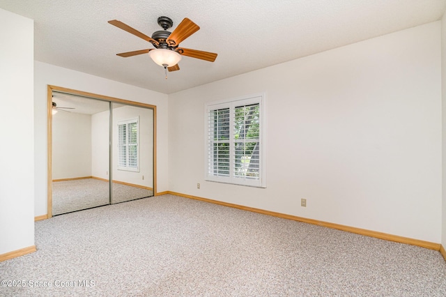 7793 Windover Way, Titusville, FL 32780 - unfurnished bedroom with carpet floors, baseboards, a closet, and a ceiling fan