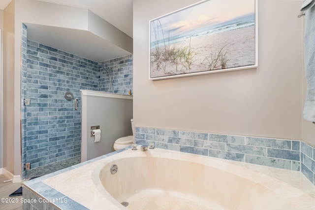 7793 Windover Way, Titusville, FL 32780 - bathroom featuring a garden tub, a stall shower, and toilet