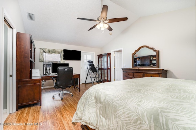 7793 Windover Way, Titusville, FL 32780 - bedroom with vaulted ceiling, light wood-style flooring, a desk, a ceiling fan, and a closet