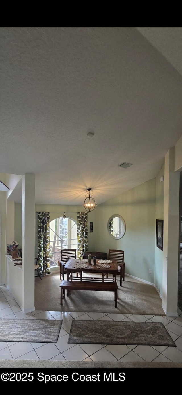 dining space with light tile patterned floors