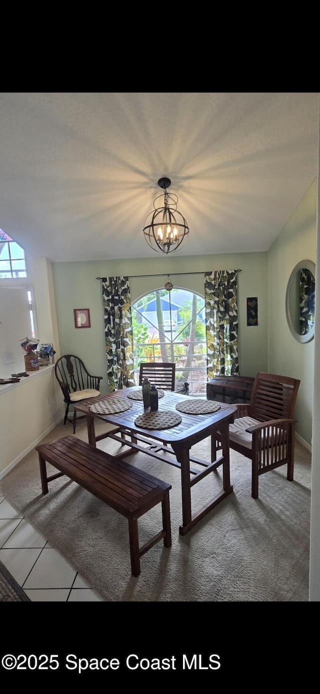 living room with healthy amount of natural light, baseboards, and carpet