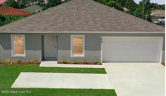 1580 Eastlake Ln, Sebastian, FL 32958 - view of front of property with roof with shingles, a garage, concrete driveway, and a front lawn
