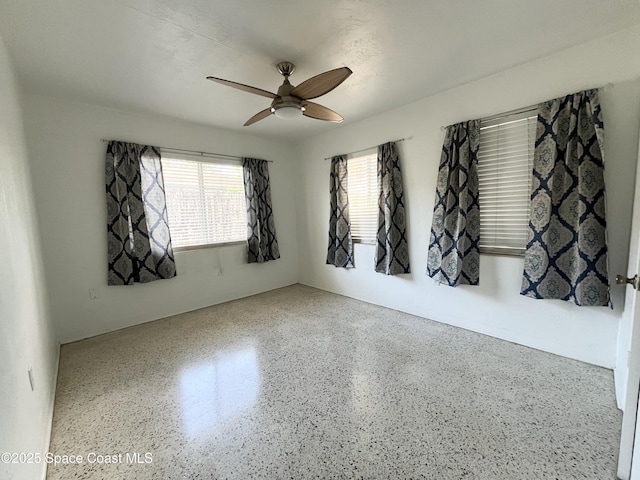 141 Valencia Rd, Rockledge, FL 32955 - spare room featuring ceiling fan and speckled floor