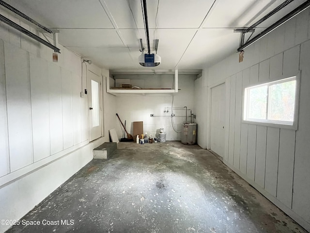 141 Valencia Rd, Rockledge, FL 32955 - garage with a garage door opener and water heater
