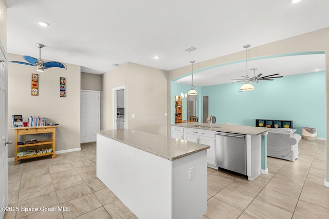 3575 Salt Marsh Cir, West Melbourne, FL 32904 - kitchen featuring dishwasher, an island with sink, ceiling fan, white cabinetry, and a sink