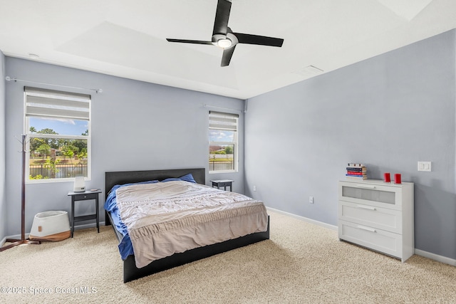 3575 Salt Marsh Cir, West Melbourne, FL 32904 - bedroom featuring multiple windows, carpet flooring, baseboards, and a ceiling fan