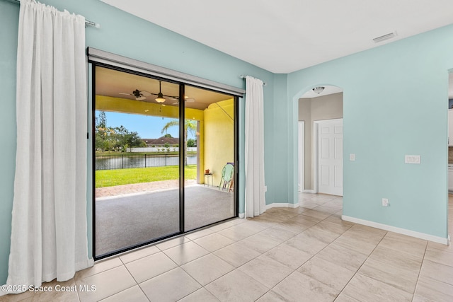 3575 Salt Marsh Cir, West Melbourne, FL 32904 - spare room with a water view, arched walkways, light tile patterned floors, and ceiling fan