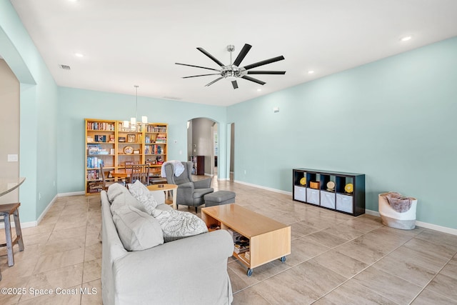 3575 Salt Marsh Cir, West Melbourne, FL 32904 - living room featuring arched walkways, ceiling fan, a chandelier, light tile patterned floors, and recessed lighting