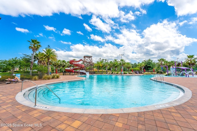 3575 Salt Marsh Cir, West Melbourne, FL 32904 - community pool featuring a water slide, fence, and a patio