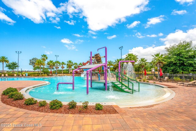 3575 Salt Marsh Cir, West Melbourne, FL 32904 - community pool with a water play area and fence