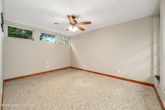 2318 Country Club Rd, Melbourne, FL 32901 - empty room featuring carpet, baseboards, and a ceiling fan