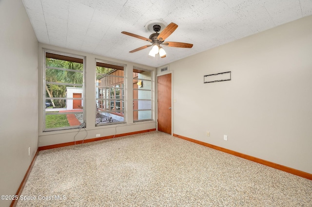 2318 Country Club Rd, Melbourne, FL 32901 - spare room with baseboards and a ceiling fan