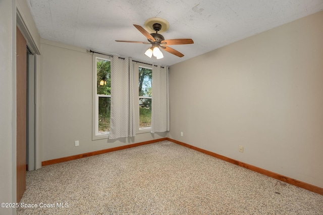 2318 Country Club Rd, Melbourne, FL 32901 - unfurnished room featuring a ceiling fan, baseboards, and carpet