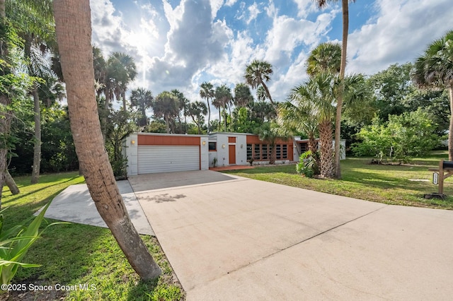 2318 Country Club Rd, Melbourne, FL 32901 - mid-century inspired home with a front lawn, a garage, and concrete driveway