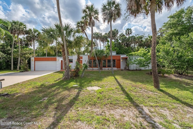 2318 Country Club Rd, Melbourne, FL 32901 - view of front of house featuring a front yard and concrete driveway