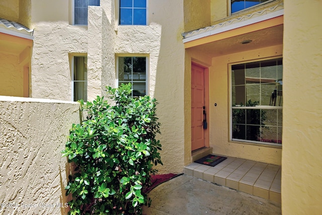 2287 Venetia Pl, Indialantic, FL 32903 - doorway to property with stucco siding