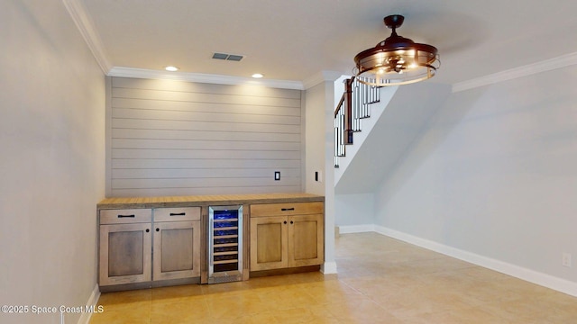 2287 Venetia Pl, Indialantic, FL 32903 - indoor dry bar featuring wine cooler, crown molding, stairs, recessed lighting, and light tile patterned floors