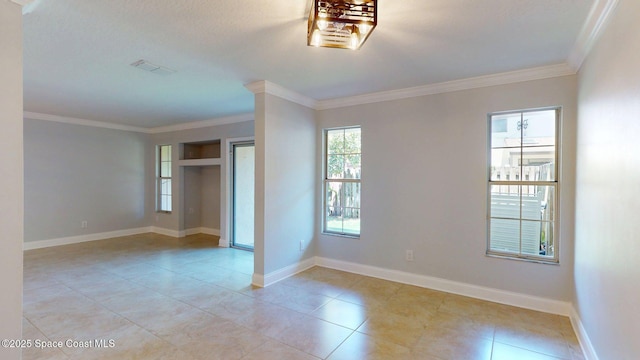 2287 Venetia Pl, Indialantic, FL 32903 - unfurnished room with ornamental molding and light tile patterned flooring