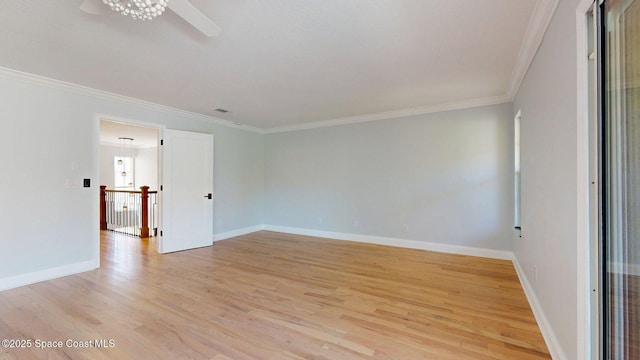 2287 Venetia Pl, Indialantic, FL 32903 - empty room with ornamental molding, light wood-type flooring, and a ceiling fan