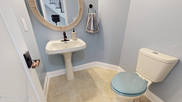 2287 Venetia Pl, Indialantic, FL 32903 - half bath featuring toilet and baseboards