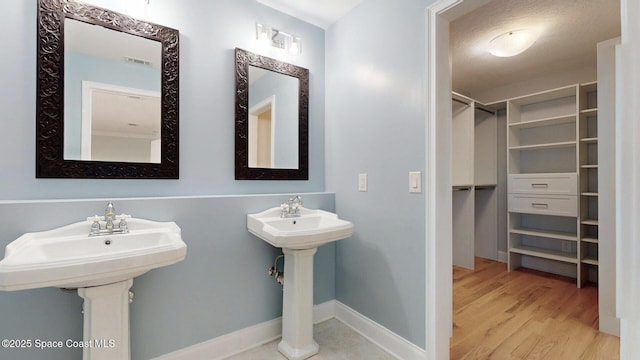 2287 Venetia Pl, Indialantic, FL 32903 - bathroom featuring wood finished floors and a spacious closet