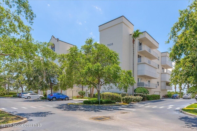 7008 Sevilla Ct Ph 505, Cape Canaveral, FL 32920 - view of property with uncovered parking